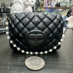 Black obsidian purse crystal carving